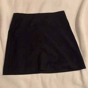 Black mini skirt - size 5 - zip back